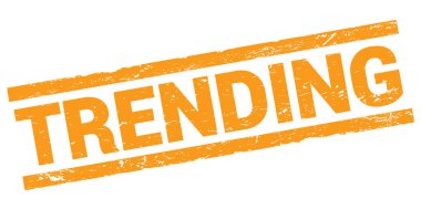 TRENDING text written on orange rectangle stamp sign.