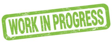 WORK IN PROGRESS text written on green rectangle stamp sign.