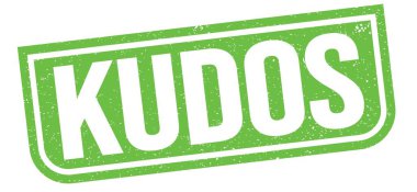Yeşil grungy işareti üzerine yazılmış KUDOS metni.