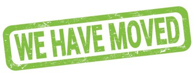 WE HAVE MOVED text written on green rectangle stamp sign.