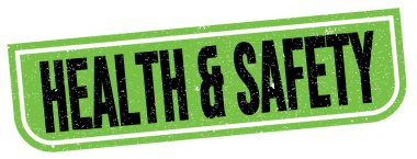 HEALTH & SAFETY text written on green-black grungy stamp sign.