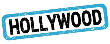 HOLLYWOOD text written on blue-black rectangle stamp sign.