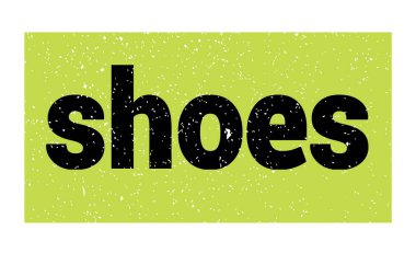 Yeşil-siyah grungy işareti üzerine yazılmış ayakkabılar.