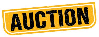 AUCTION text written on yellow-black grungy stamp sign.