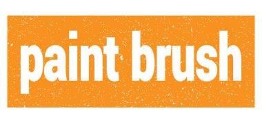paint brush text written on orange grungy stamp sign.