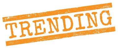 Turuncu grungy çizgileri damgası üzerine yazılmış TRENDING metin.