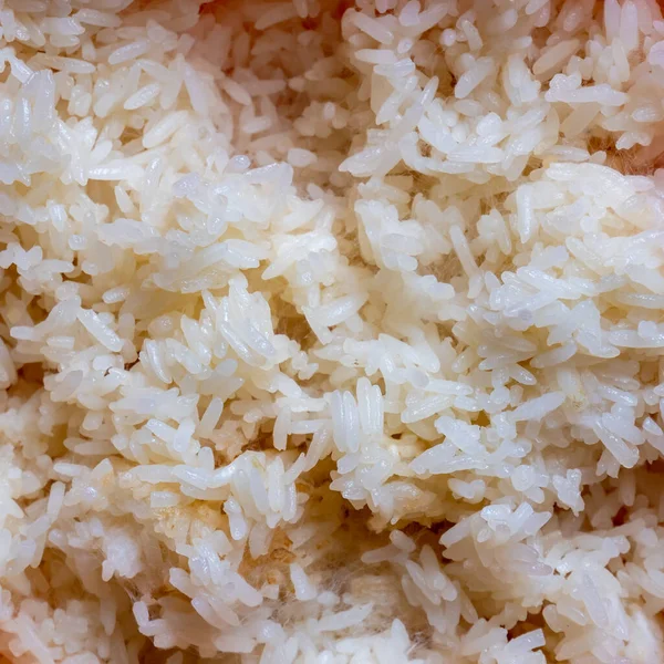 The glutinous rice was left overnight, until spoiled.