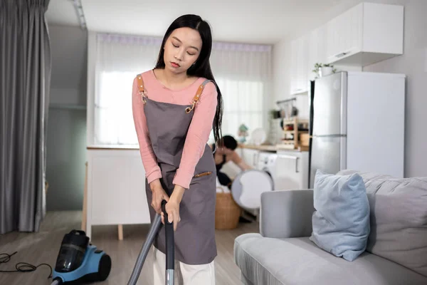Young Asian Married Woman Bored Frustrated While Using Vacuum Cleaner — Stock Photo, Image