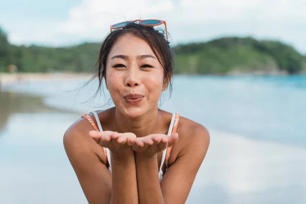 Smiling Beautiful Asian Woman Blowing Kiss Bikini Beach Sea Background — Zdjęcie stockowe