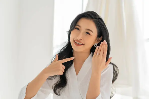 Asian Smiling Bride Bathrobe Showcases Her Diamond Wedding Ring Sparkle Stock Image
