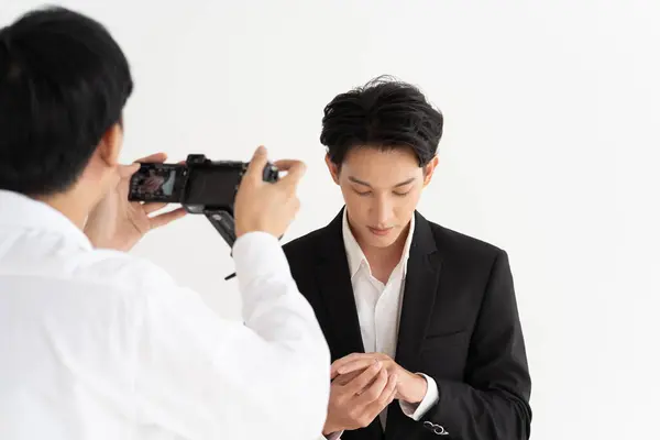 Asian Groom Stylish Suit Meticulously Adjusts His Cufflinks Photographer Captures Stock Image