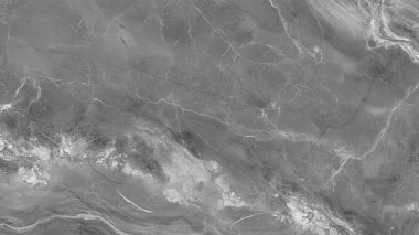 Gri mermer dokuda, çeşitli tasarım projeleri ve sanatsal ifadeler için minimalist tarzda sofistike bir zemin oluşturan eşsiz damar ve desenler bulunur.