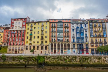 Bilbao, Spain - July 1, 2024 - buidings with Palestinian flags in Casco Viejo clipart