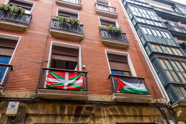 stock image Bilbao, Spain - July 1, 2024 - buidings with Palestinian and Basque flags in Casco Viejo