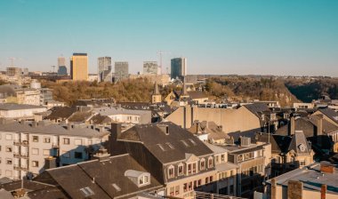 Aerial panorama sunset view of downtown Luxembourg City with Kirchberg Skyline clipart