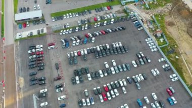 Parking lot at dealer site for sale market, aerial view