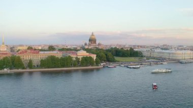 Aerial top view of the Neva River, the buildings of the Admiralty and St. Isaac's Cathedral, Alexander Garden evening