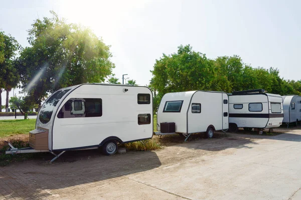 Mobile homes uncoupled from cars in the parking lot, mobile housing
