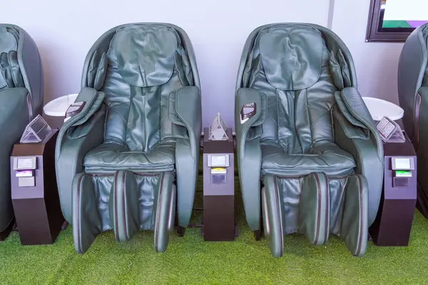 Massage vibrating leather chairs in a public place, per minute rental.