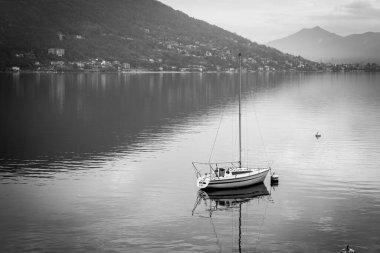 Winter sunset panorama of the quiet waters of Maggiore Lake. Is the 2nd biggest lake in Italy (after Garda) and it is divided between Italy and Switzerland territory.
