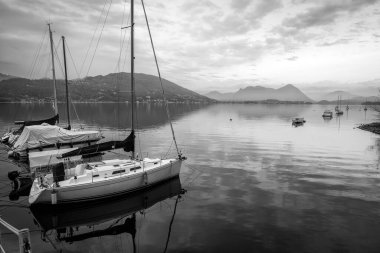 Winter sunset panorama of the quiet waters of Maggiore Lake. Is the 2nd biggest lake in Italy (after Garda) and it is divided between Italy and Switzerland territory.