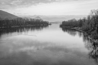 Winter panorama of the end of Toce river (Piedmont, Northern Italy) near the village of Fondotoce (VCO Province), at the point where it flows into the waters of Lake Maggiore.