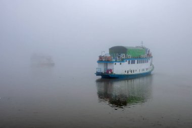 Tourist boat on winter morning in Sundarbans.this photo was taken from Sundarbans National Park,Bangladesh. clipart