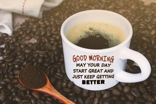 Motivational quote on cup of coffee on coffee beans background - Good morning, may your day start great and just keep getting better.