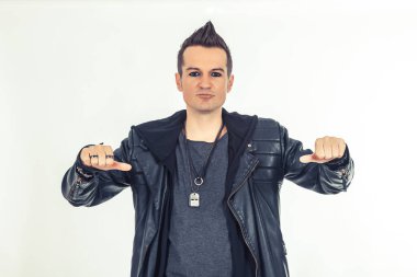 Portrait of hard rock performer gesturing over white background.