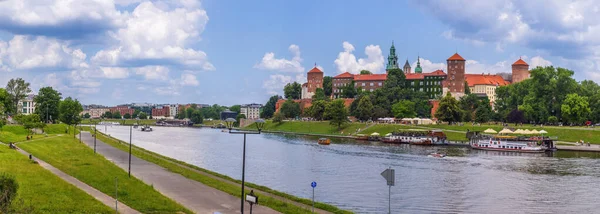 stock image The Vistula river runs directly beneath Krakows royal palace on Wawel Hill and makes for a relaxing afternoon in the sun. 