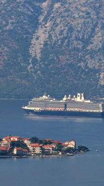 Kotor, Montenegro - September 15 2021: Cruise ship sails from the port of Kotor to Adriatic Sea vertical video