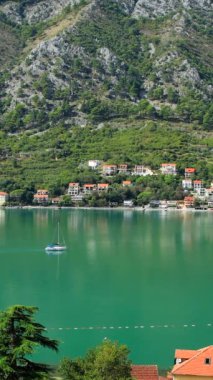 Boat in the Kotor bay Montenegro in the morning vertical video