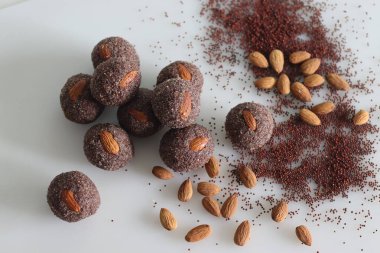 Ragi coconut ladoos. Made with a mixture of ragi flour, jaggery, ghee, cardamom and shredded coconut. Finger millet coconut ladoos are healthy as it is rich in iron and other minerals.
