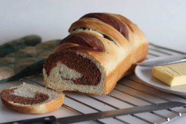 Vanilla Chocolate Swirl Bread. It is a delicious, bakery style bread made with dough of vanilla, chocolate and sweet milk. Dough is swirled together to create a beautiful marbled effect before baking