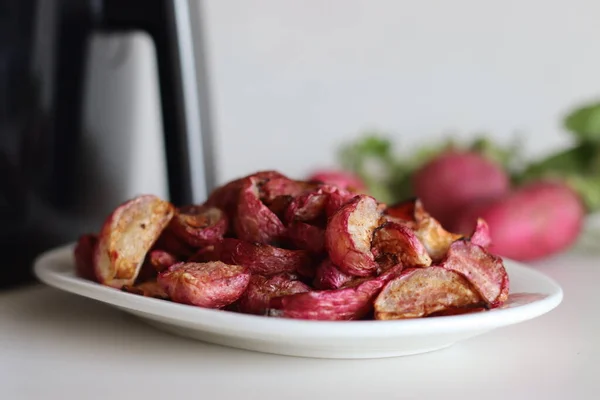 Air fried table radish. A table radish dish made by marinating it with olive oil, herbs and air fried. Shot along with air fryer and a bunch of fresh radish.