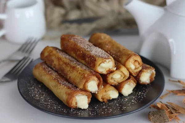 Delectable French Toast Rolls. A sweet breakfast treat with sweetened cottage cheese in the middle. A variation of traditional French Toast. Homemade delights for brunch and morning cravings