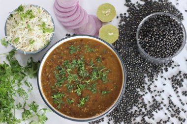 Flavorful maa ki dal paired with fragrant jeera rice, authentic Indian dish, vegetarian cuisine. Maa ki dal also known as kaali dal is a popular Indian dish made from black lentils, that is urad dal clipart