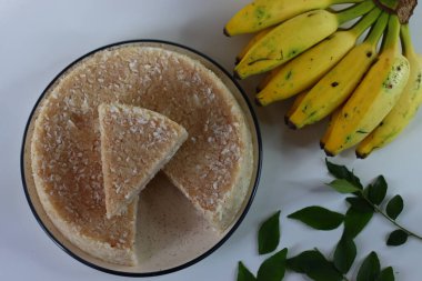 Paputtu or Paal Puttu made with matta rice, a Kerala brown rice, served with chickpea curry and plantain. Traditional Coorg dish, paputtu is steamed rice cake cooked with milk and shredded coconut clipart