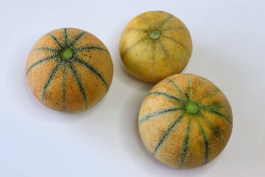 Madhu miskkavunlarının tamamı kavun ya da kabuklu ağ ve yeşil şeritli kharbooja olarak da adlandırılır. Sağlıklı beslenme, tropikal yemekler ve yemek görselleri için mükemmel kokulu bir Hint yaz meyvesi.