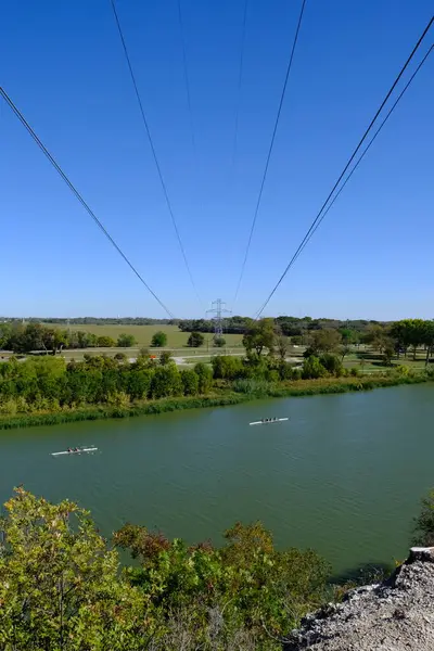 This is a photograph I shot while hiking the trails in Cameron Park. You can see the Brazos River and Waco Texas. You can see people kayaking in the water.
