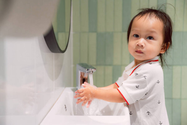 Little Child Bathroom Washing Hands Surrounded Parent Promoting Child Health Royalty Free Stock Photos