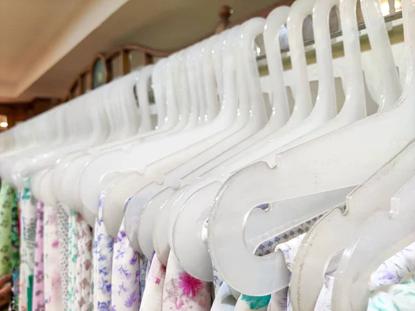 Selective focus of Dress on a plastic hangers.
