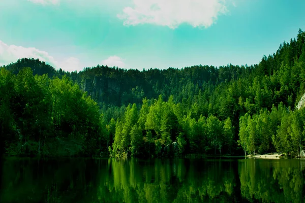 The lake in the rocks, gorgeous scenery. Climbing to the summit.