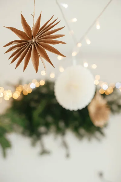 Stylish Paper Christmas Stars Lights Hanging Background Festive Decorated Boho — Stockfoto