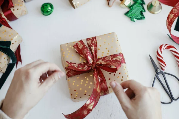 Person Preparing Modern Gift Box Red Ribbon Golden Wrapping Paper — 스톡 사진