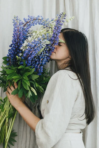 Stylish Woman Holding Lupine Bouquet Rustic Room Gathering Arranging Summer — Stock fotografie