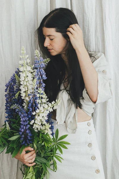 Stylish Woman Holding Lupine Bouquet Rustic Room Gathering Arranging Summer — Foto Stock