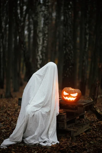 Spooky Ghost Sitting Glowing Jack Lantern Moody Dark Autumn Forest — Stock Photo, Image