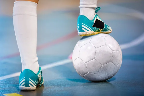 Feet Of White Team Indoor Soccer Player Tread On Soccer Ball For Kick-Off on Training Pitch