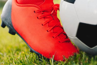 Soccer cleat and soccer ball. Moment of football ball kick